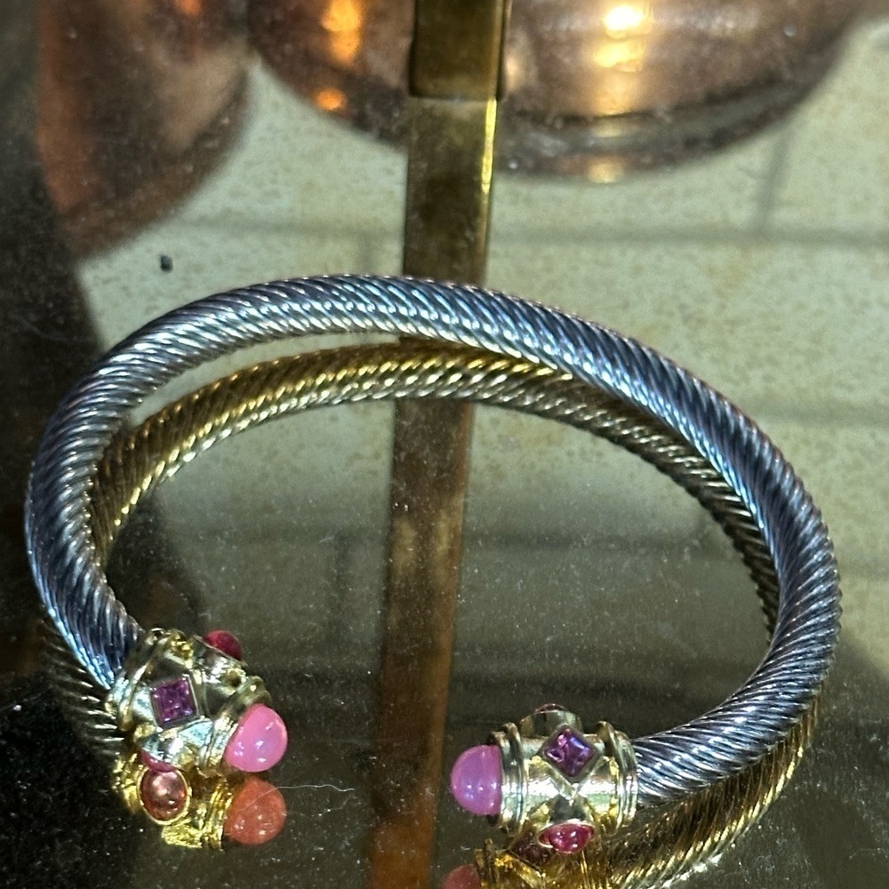 Sophisticated Silvertone Bracelet with pink stones titanium. Gold accents